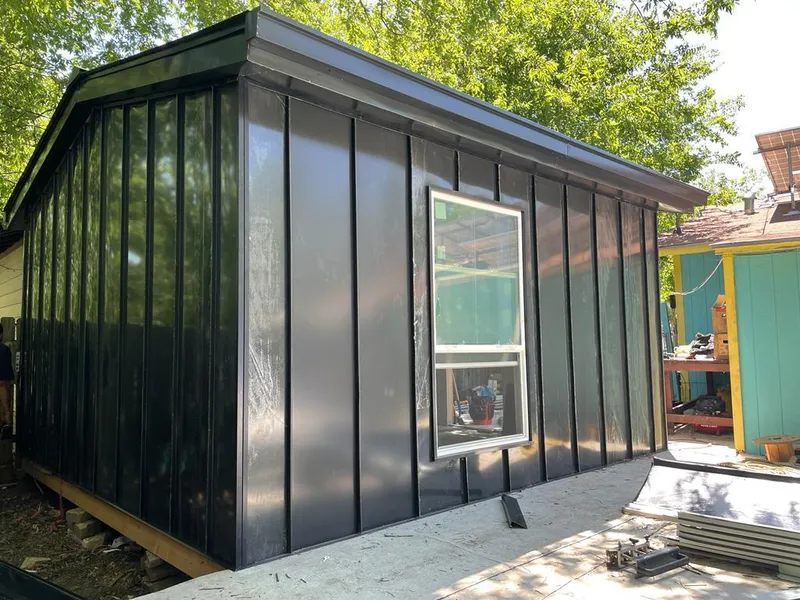 Black standing seam metal wall panels for Roof Inspection in Sky Lake